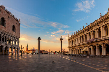 Dawn breaks over the Doges Palace and the island of San Giorgio seen from St. Mark's Square in...