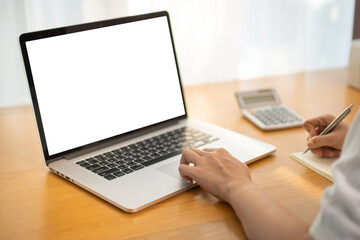 Fototapeta premium Unrecognizable Asian happy woman using her personal laptop computer for working and making a video conference