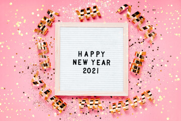 Happe New Year 2021 letterboard and christmas decorations. Top horizontal view copyspace festive holiday background