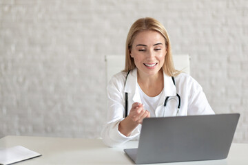 Woman doctor conducting online consultation