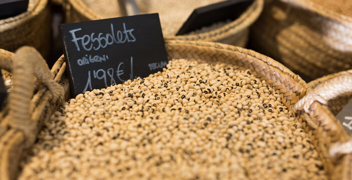 Black-eyed Peas In Wicker Basket On Shelf Of Grocery Store. High Quality Photo