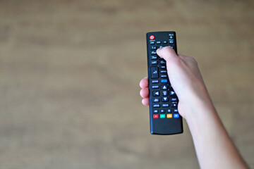 remote control in hand