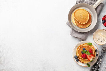 Delicious pancakes with berries and coffee