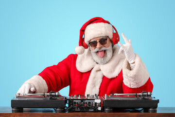 Cool Santa DJ playing music on color background - obrazy, fototapety, plakaty