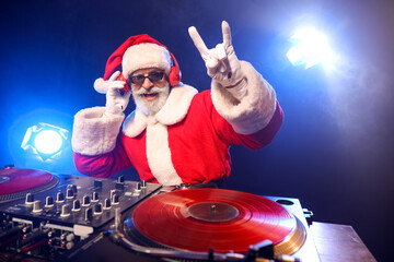 Cool Santa DJ playing music in club
