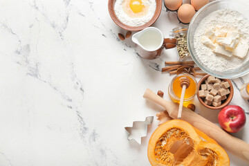 Ingredients for preparing pumpkin pie on white background