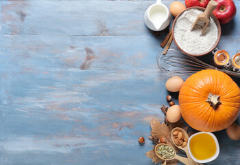 Obraz na płótnie Canvas Ingredients for preparing pumpkin pie on color wooden background