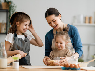 Fototapeta premium family are preparing bakery together