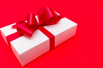 Top view White gift box ribbon flat lay red background.Christmas concept.