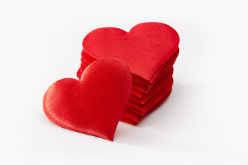 Hearts from red satin, the concept of congratulations for Valentine's Day and Wedding Day.