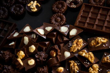 Lots of milk and dark chocolates with nuts, berries and sweet sprinkles.