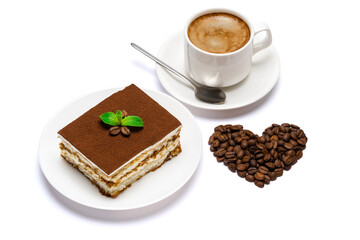 Traditional Italian Tiramisu square dessert portion on ceramic plate and heart shape made of coffee beans isolated on white background with clipping path
