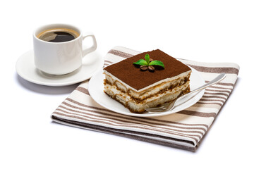 Traditional Italian Tiramisu dessert square portion on ceramic plate and cup of fresh espresso coffee isolated on white background with clipping path