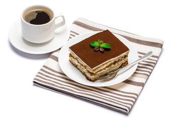 Traditional Italian Tiramisu dessert square portion on ceramic plate and cup of fresh espresso coffee isolated on white background with clipping path