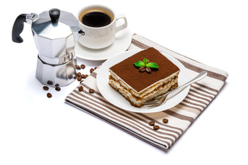 Traditional Italian Tiramisu dessert square portion on ceramic plate, mocha coffee maker and cup of fresh espresso coffee isolated on white background with clipping path