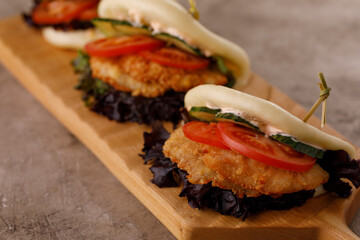 Steamed wheat bun dressed with designer sauce. Vietnamese cuisine concept. Still life. Close-up.