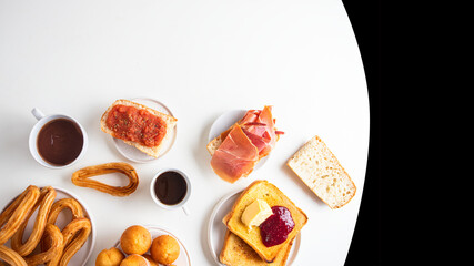 Spanish breakfast  banner.Tortilla, bruschetta with jamon and tomatoes,   crusty toast with butter and jam , Spanish muffin, coffee and orange juice. Typical breakfast in Spain banner.