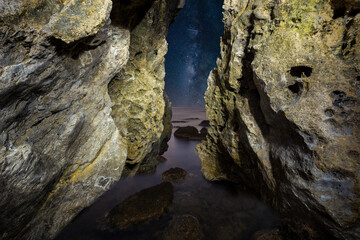 Fototapeta na wymiar View from a rock grotto by the sea, Rhodos, Greece