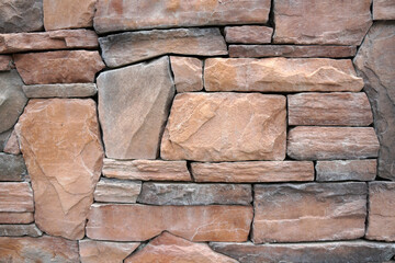 Sandstone rock stone wall background.
