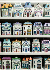 Naklejka premium Grandmothers vintage kitchen spices shelf tools for cooking in old house formed porcelain containers