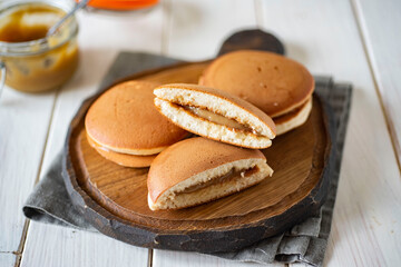 Sweet Japanese pancakes for Breakfast on a beautiful Board on a white background