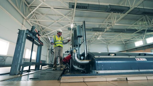 Wastewater tanks are getting handled by a male expert