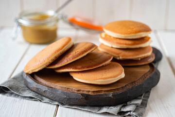 Sweet Japanese pancakes for Breakfast on a beautiful Board on a white background
