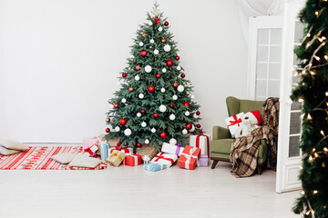 New Year's card interior of the white room red decor and Christmas tree with gifts