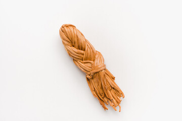 pigtail cheese on white background, smoked cheese