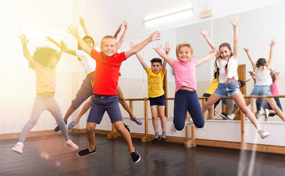 Children with teacher participating in dance class. High quality photo