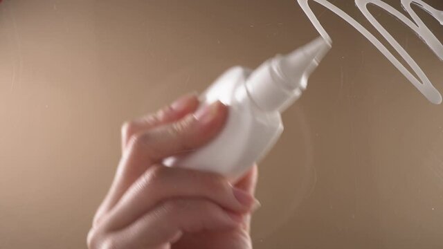 A person smears the surface with PVA&nbsp;glue
