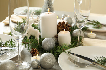 Obraz na płótnie Canvas Concept of romantic New year table setting on gray table