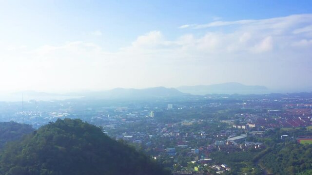 4K Areal drone view moving from town to sky. Summer blue sky with cloud moving pan camera.