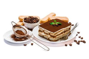 Traditional Italian Tiramisu dessert square portion on ceramic plate and savoiardi cookies isolated on white