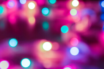 Obraz premium Abstract background in the form of a beautiful multicolored bokeh. Christmas design concept