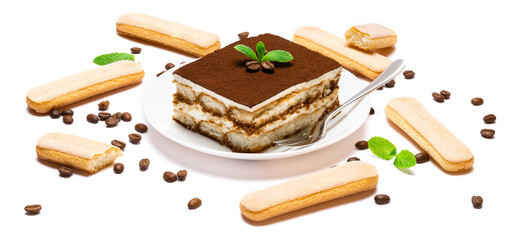 Traditional Italian Tiramisu square dessert portion on ceramic plate, savoiardi cookies and coffee beans isolated on white