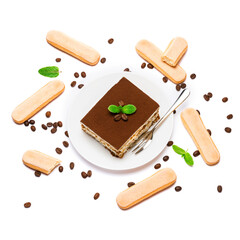Traditional Italian Tiramisu square dessert portion on ceramic plate, savoiardi cookies and coffee beans isolated on white