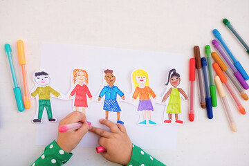 Closeup child girl drawing with colored markers pens international children of different races, Happy  world  children s day