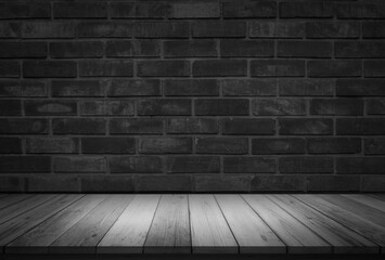 Empty wooden table top on black dark brick wall background, Design wood counter white. Perspective for show space for your copy and branding. Can be used as product display montage. Vintage style.