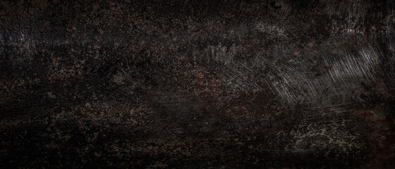 Rough rusty and scratched metal texture. Dark or black background