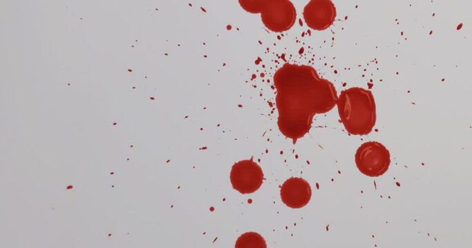Red blood liquid dripping down on white floor.