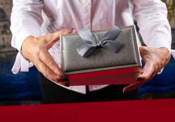 The girl opens the gift.