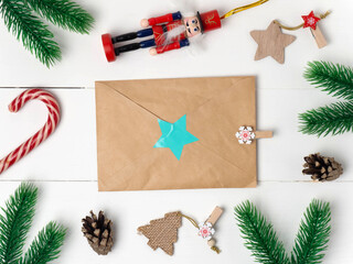 Christmas holiday background with blackboard and decorations, letter on grey textured blackboard top view