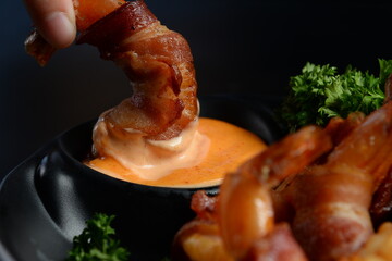 Deep fried bacon wrapped shrimp dipping mayo sauce