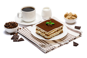 Traditional Italian Tiramisu dessert square portion on ceramic plate and cup of fresh espresso coffee isolated on white