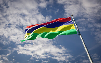 Mauritius national flag waving at sky background close-up.