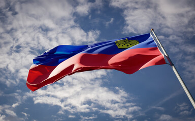 Liechtenstein national flag waving at sky background close-up.