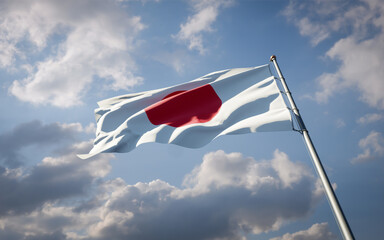 Japan national flag waving at sky background close-up.
