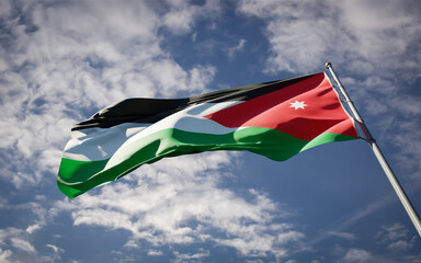Jordan national flag waving at sky background close-up.