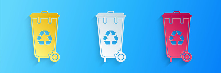 Paper cut Recycle bin with recycle symbol icon isolated on blue background. Trash can icon. Garbage bin sign. Recycle basket icon. Paper art style. Vector.